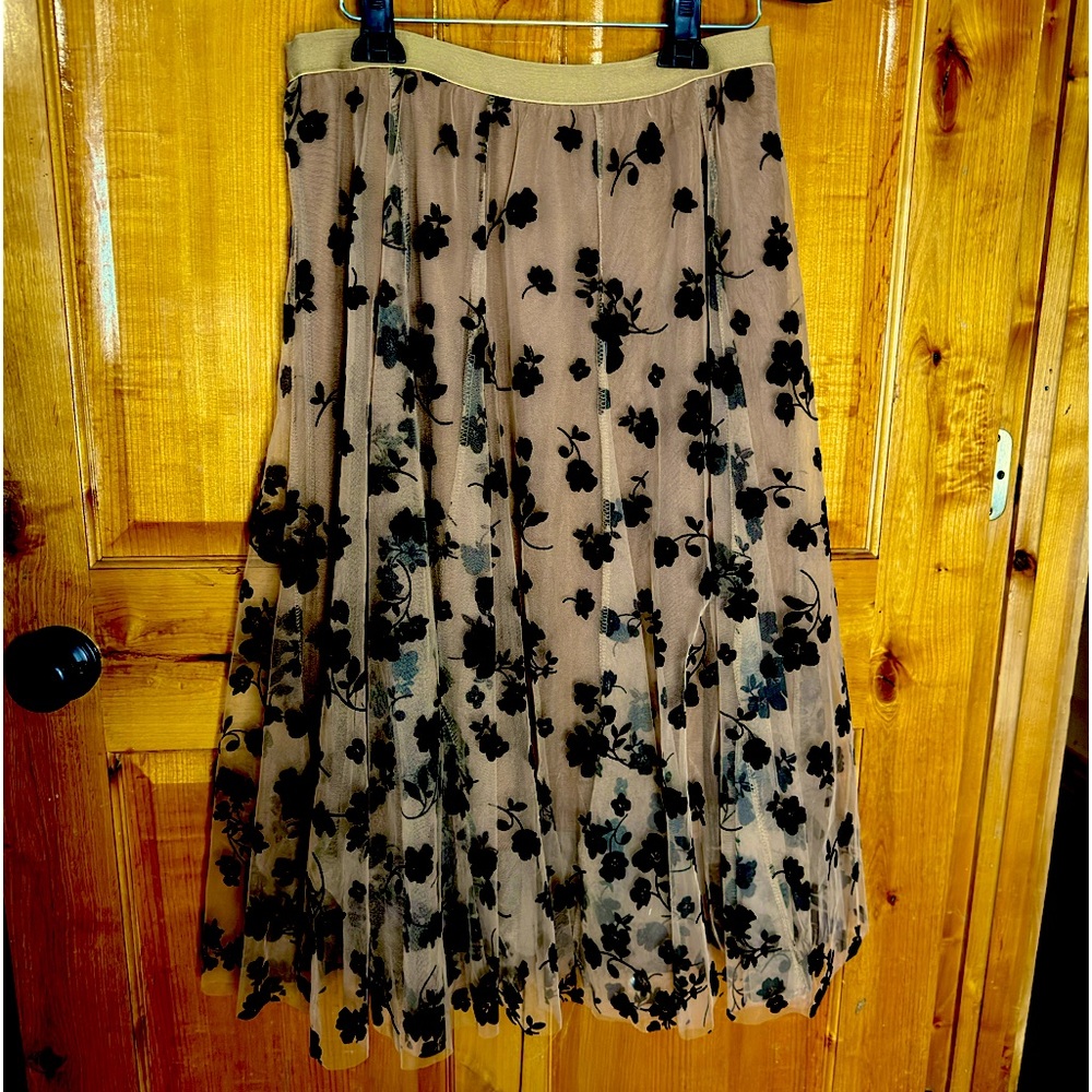 Sheer floral skirt with velvet flowers.